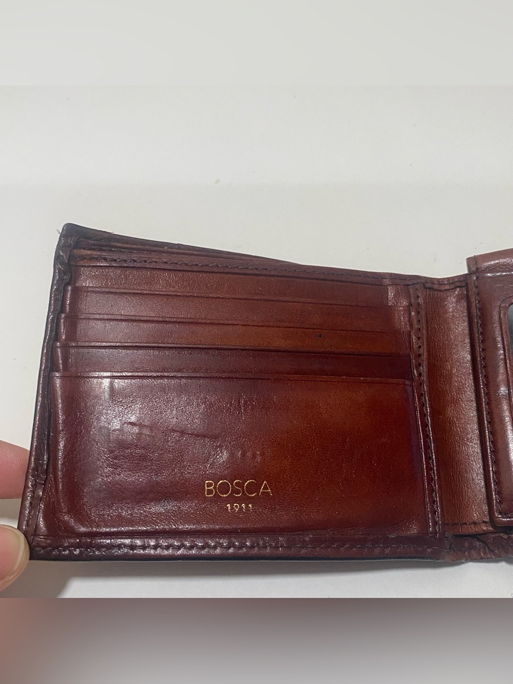 BOSCA Men's Brown Leather Bi-Fold Wallet - stains on it